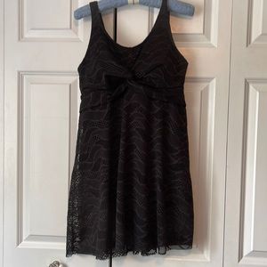 Women’s size large (14/16) bathing suit. Never worn. Full coverage lace overlay